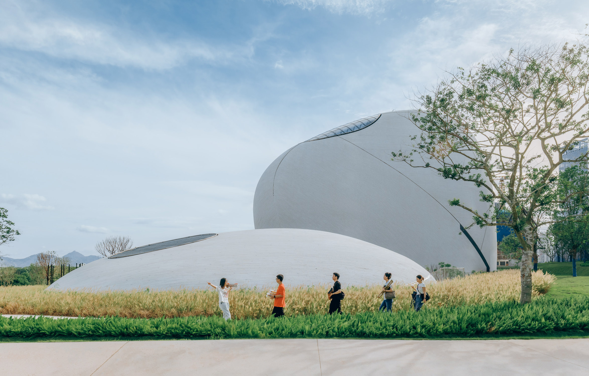 MAD completes design museum under green hill in Shenzhen