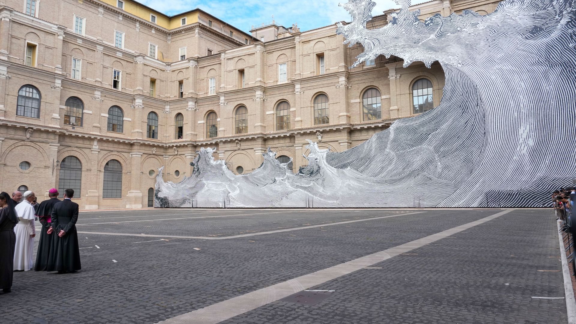 JR placed a wave on the facade of the Vatican Library